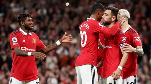 MANCHESTER, ENGLAND - MAY 25: Bruno Fernandes of Manchester United celebrates with Fred and Marcus Rashford after scoring the team's third goal during the Premier League match between Manchester United and Chelsea FC at Old Trafford on May 25, 2023 in Manchester, England. (Photo by Catherine Ivill/Getty Images)