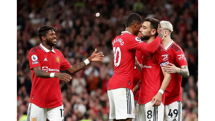 MANCHESTER, ENGLAND - MAY 25: Bruno Fernandes of Manchester United celebrates with Fred and Marcus Rashford after scoring the team's third goal during the Premier League match between Manchester United and Chelsea FC at Old Trafford on May 25, 2023 in Manchester, England. (Photo by Catherine Ivill/Getty Images)