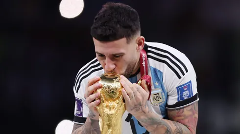 LUSAIL CITY, QATAR – DECEMBER 18: Nicolas Otamendi of Argentina kisses the FIFA World Cup Qatar 2022 Winner's Trophy during the FIFA World Cup Qatar 2022 Final match between Argentina and France at Lusail Stadium on December 18, 2022 in Lusail City, Qatar. (Photo by Clive Brunskill/Getty Images)