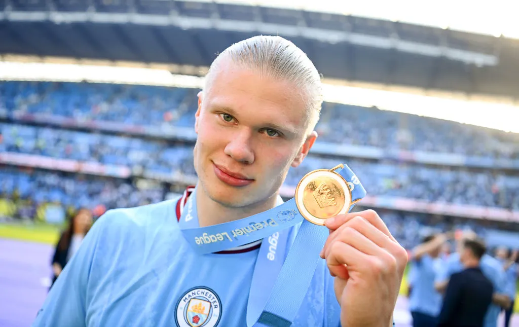 MANCHESTER, ENGLAND – MAY 21: Erling Haaland of Manchester City with his Premier League winners medal after the Premier League match between Manchester City and Chelsea FC at Etihad Stadium on May 21, 2023 in Manchester, England. (Photo by Michael Regan/Getty Images)