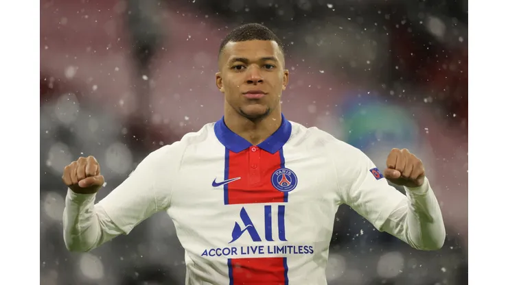 MUNICH, GERMANY - APRIL 07: Kylian Mbappe of Paris Saint-Germain celebrates after scoring their side's first goal during the UEFA Champions League Quarter Final match between FC Bayern Munich and Paris Saint-Germain at Allianz Arena on April 07, 2021 in Munich, Germany. Sporting stadiums around Germany remain under strict restrictions due to the Coronavirus Pandemic as Government social distancing laws prohibit fans inside venues resulting in games being played behind closed doors. (Photo by Alexander Hassenstein/Getty Images)