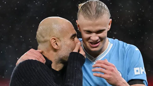 Pep Guardiola talks to Erling Haaland (Photo by Michael Regan/Getty Images)