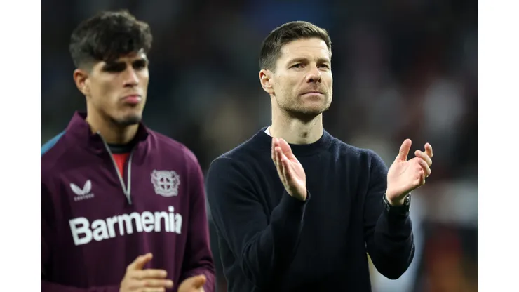 LEVERKUSEN, GERMANY - MARCH 14: Xabi Alonso, Head Coach of Bayer Leverkusen, applauds the fans following the team's victory during the UEFA Europa League 2023/24 round of 16 second leg match between Bayer 04 Leverkusen and Qarabag FK at BayArena on March 14, 2024 in Leverkusen, Germany. (Photo by Alex Grimm/Getty Images)