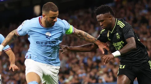 Vinicius Junior of Real Madrid by Kyle Walker of Manchester City . (Photo by Clive Brunskill/Getty Images)