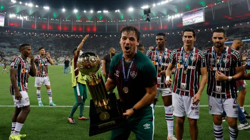 RIO DE JANEIRO, BRAZIL - FEBRUARY 29: Fernando Diniz head coach of Fluminense celebrates with the trophy after winning the Recopa Sudamericana 2024 second leg match between Fluminense and Liga de Quito at Maracana Stadium on February 29, 2024 in Rio de Janeiro, Brazil. (Photo by Wagner Meier/Getty Images)