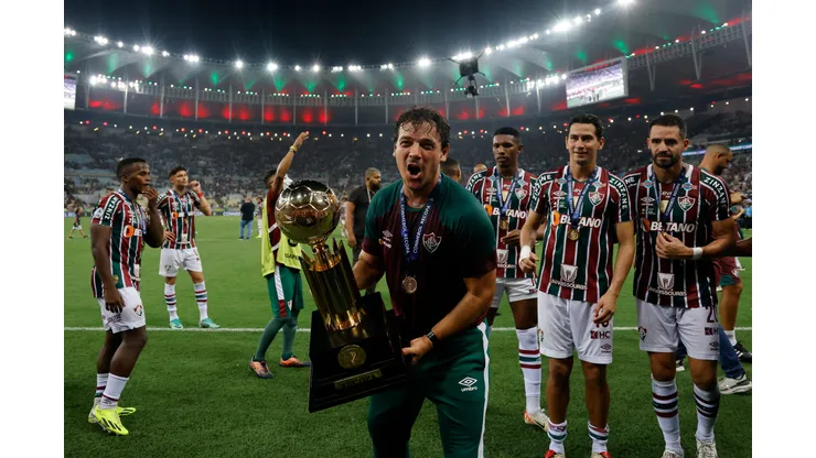RIO DE JANEIRO, BRAZIL - FEBRUARY 29: Fernando Diniz head coach of Fluminense celebrates with the trophy after winning the Recopa Sudamericana 2024 second leg match between Fluminense and Liga de Quito at Maracana Stadium on February 29, 2024 in Rio de Janeiro, Brazil. (Photo by Wagner Meier/Getty Images)