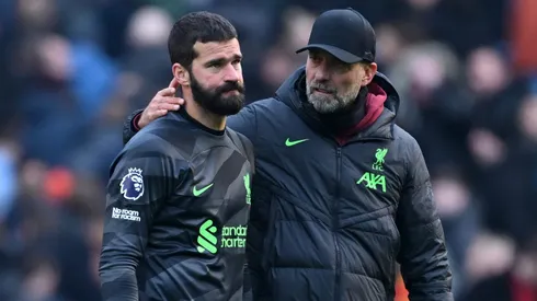 Alisson Becker of Liverpool is consoled by Manager Juergen Klopp . (Photo by Michael Regan/Getty Images)