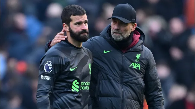 Alisson Becker of Liverpool is consoled by Manager Juergen Klopp . (Photo by Michael Regan/Getty Images)