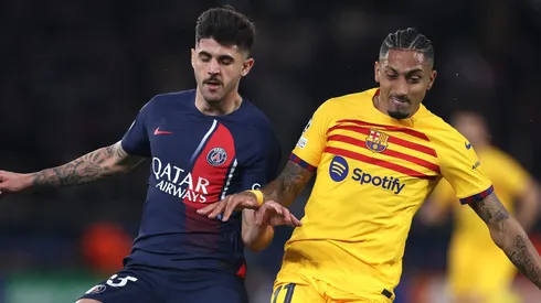 Nuno Mendes of Paris Saint-Germain and Raphinha of FC Barcelona . (Photo by Alex Pantling/Getty Images)