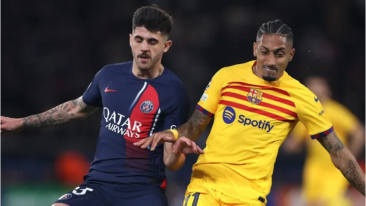 Nuno Mendes of Paris Saint-Germain and Raphinha of FC Barcelona . (Photo by Alex Pantling/Getty Images)