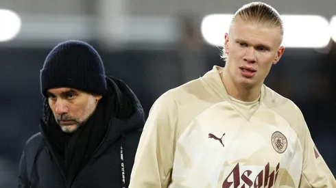 Erling Haaland of Manchester City looks on alongside Pep Guardiola, (Photo by Richard Heathcote/Getty Images)