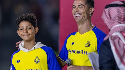 RIYADH, SAUDI ARABIA – JANUARY 03: Cristiano Ronaldo and his son Cristiano Ronaldo Jr greet the crowd during the official unveiling of Cristiano Ronaldo as an Al Nassr player at Mrsool Park Stadium on January 3, 2023 in Riyadh, Saudi Arabia. (Photo by Yasser Bakhsh/Getty Images)