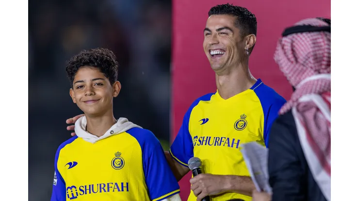 RIYADH, SAUDI ARABIA - JANUARY 03: Cristiano Ronaldo and his son Cristiano Ronaldo Jr greet the crowd during the official unveiling of Cristiano Ronaldo as an Al Nassr player at Mrsool Park Stadium on January 3, 2023 in Riyadh, Saudi Arabia. (Photo by Yasser Bakhsh/Getty Images)