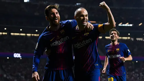 Andres Iniesta of FC Barcelona celebrates with his team mate Lionel Messi (Photo by David Ramos/Getty Images)