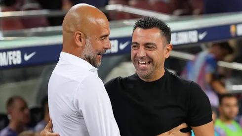 Pep Guardiola, and Xavi, Head coach of FC Barcelona (Photo by Alex Caparros/Getty Images)