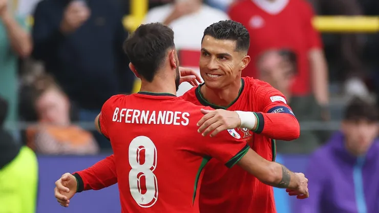 DORTMUND, GERMANY - JUNE 22: Bruno Fernandes of Portugal celebrates scoring his team's third goal with teammate Cristiano Ronaldo during the UEFA EURO 2024 group stage match between Turkiye and Portugal at Football Stadium Dortmund on June 22, 2024 in Dortmund, Germany. (Photo by Lars Baron/Getty Images)