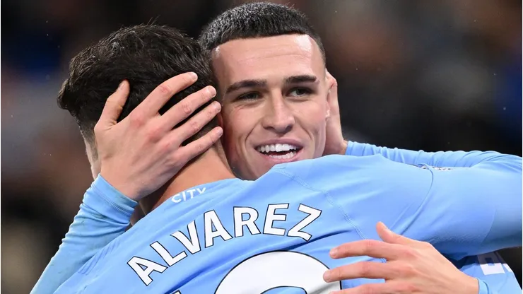 MANCHESTER, ENGLAND - DECEMBER 03: Phil Foden of Manchester City celebrates with teammate Julian Alvarez after scoring the team's second goal during the Premier League match between Manchester City and Tottenham Hotspur at Etihad Stadium on December 03, 2023 in Manchester, England. (Photo by Stu Forster/Getty Images)