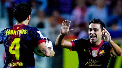 Fabregas e Xavi ganharam muitos títulos jogando juntos no Barcelona. Foto: Gonzalo Arroyo Moreno/Getty Images