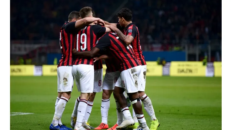 Fabio Borini of AC Milan celebrates with his teammates after