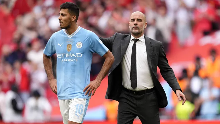 Rodri e Guardiola lado a lado