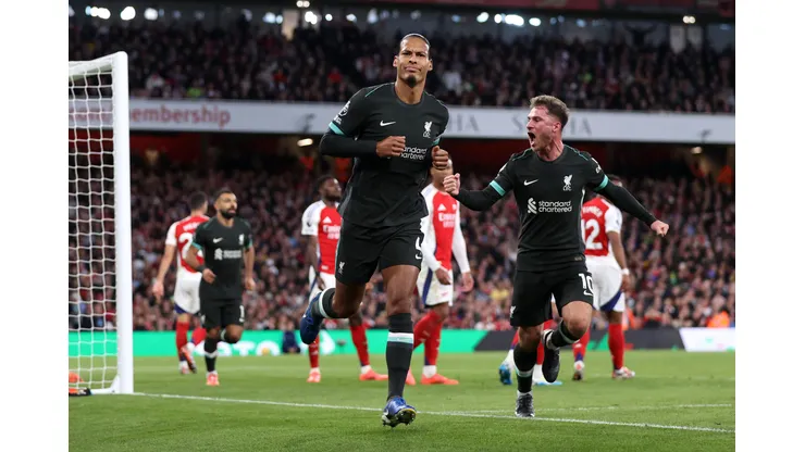 LONDON, ENGLAND - OCTOBER 27: Virgil van Dijk of Liverpool celebrates scoring his team's first goal with Alexis Mac Allister during the Premier League match between Arsenal FC and Liverpool FC at Emirates Stadium on October 27, 2024 in London, England. (Photo by Alex Pantling/Getty Images)