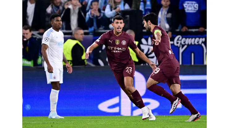 BRATISLAVA, SLOVAKIA - OCTOBER 01: Ilkay Guendogan of Manchester City celebrates scoring his team's first goal with teammate Matheus Nunes during the UEFA Champions League 2024/25 League Phase MD2 match between SK Slovan Bratislava and Manchester City at Tehelne Pole on October 01, 2024 in Bratislava, Slovakia. (Photo by Christian Bruna/Getty Images)