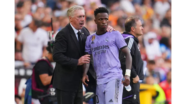 VALENCIA, SPAIN - MAY 21: Carlo Ancelotti, Head Coach of Real Madrid, interacts with Vinicius Junior of Real Madrid during the LaLiga Santander match between Valencia CF and Real Madrid CF at Estadio Mestalla on May 21, 2023 in Valencia, Spain. (Photo by Aitor Alcalde/Getty Images)