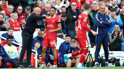 LIVERPOOL, ENGLAND – SEPTEMBER 14: Arne Slot, Manager of Liverpool, talks to Trent Alexander-Arnold of Liverpool during the Premier League match between Liverpool FC and Nottingham Forest FC at Anfield on September 14, 2024 in Liverpool, England. (Photo by Carl Recine/Getty Images)