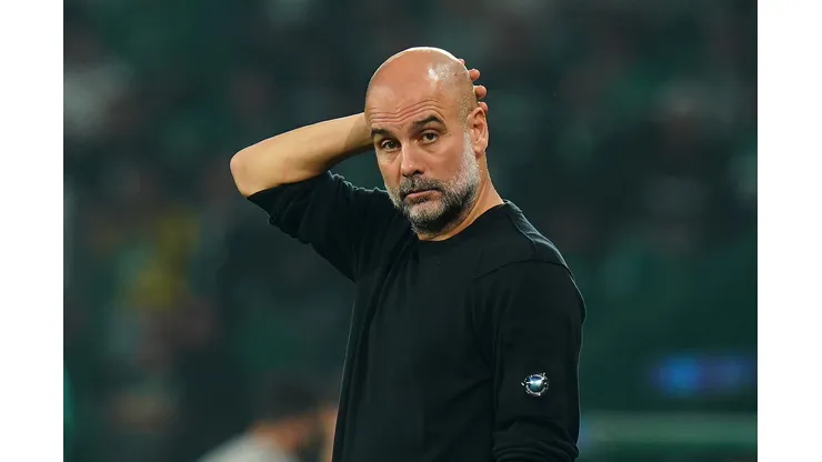 LISBON, PORTUGAL - NOVEMBER 05: Pep Guardiola, Manager of Manchester City, looks on during the UEFA Champions League 2024/25 League Phase MD4 match between Sporting Clube de Portugal and Manchester City at Estadio Jose Alvalade on November 05, 2024 in Lisbon, Portugal. (Photo by Gualter Fatia/Getty Images)