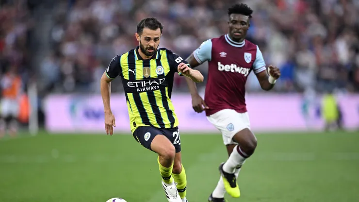 Bernardo Silva e Kudus em jogo entre West Ham e Manchester City. Foto: Justin Setterfield