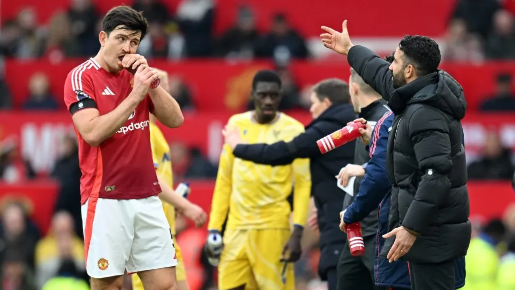 MANCHESTER, ENGLAND – FEBRUARY 02: Harry Maguire of Manchester United has a drink as he is given instructions by Ruben Amorim, Head Coach of Manchester United, during the Premier League match between Manchester United FC and Crystal Palace FC at Old Trafford on February 02, 2025 in Manchester, England. (Photo by Michael Regan/Getty Images)