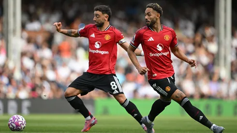 Bruno Fernandes e Matheus Cunha em jogo do United na Premier League (Foto: Mike Hewitt/Getty Images)
