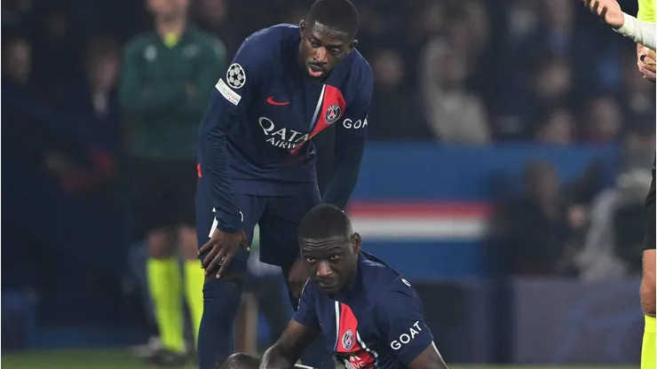 PARIS, FRANCE - OCTOBER 25: Fikayo Tomori of AC Milan reacts after receiving a yellow card from Referee Slavko Vincic for a foul on Randal Kolo Muani of Paris Saint-Germain during the UEFA Champions League match between Paris Saint-Germain and AC Milan at Parc des Princes on October 25, 2023 in Paris, France. (Photo by Mike Hewitt/Getty Images)