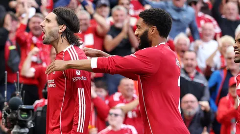 LIVERPOOL, ENGLAND – AUGUST 31: Dominik Szoboszlai of Liverpool celebrates scoring his team's first goal from a free kick during the Premier League match between Liverpool and Arsenal at Anfield on August 31, 2025 in Liverpool, England. (Photo by Carl Recine/Getty Images)