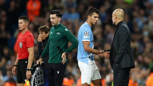 MANCHESTER, ENGLAND - SEPTEMBER 18: Rodri of Manchester City speaks to Pep Guardiola, Manager of Manchester City, after being substituted during the UEFA Champions League 2025/26 League Phase MD1 match between Manchester City and SSC Napoli at City of Manchester Stadium on September 18, 2025 in Manchester, England. (Photo by Dan Istitene/Getty Images)