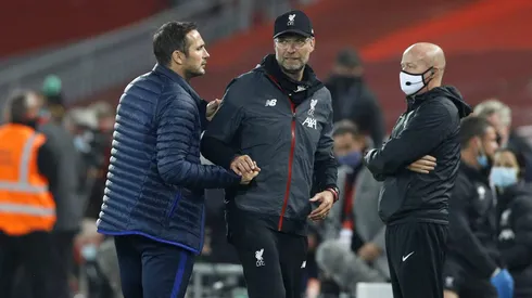 LIVERPOOL, ENGLAND - JULY 22: Frank Lampard, Manager of Chelsea and Jurgen Klopp, Manager of Liverpool embrace following during the Premier League match between Liverpool FC and Chelsea FC at Anfield on July 22, 2020 in Liverpool, England. Football Stadiums around Europe remain empty due to the Coronavirus Pandemic as Government social distancing laws prohibit fans inside venues resulting in all fixtures being played behind closed doors. (Photo by Phil Noble/Pool via Getty Images)