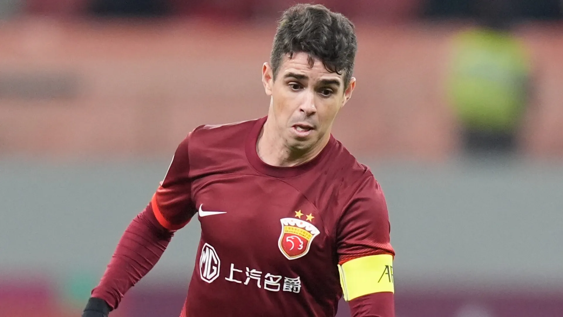 Oscar em jogo do Shanghai Port como capitão 
