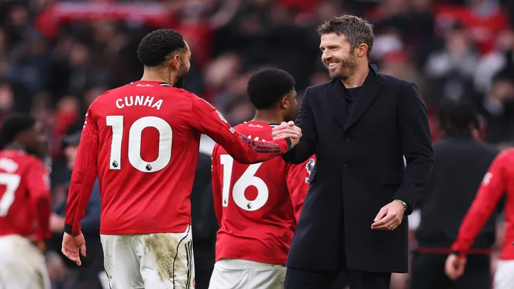 Matheus Cunha e Michael Carrick - Carl Recine/Getty Images