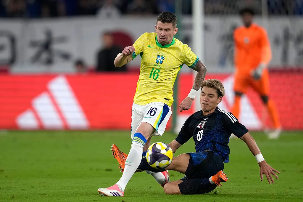 CHOFU, JAPAN – OCTOBER 14: Caio Henrique of Brazil (L) goes past Ritsu Doan of Japan (R) during the international friendly match between Japan and Brazil at Tokyo Stadium on October 14, 2025 in Chofu, Tokyo, Japan. (Photo by Toru Hanai/Getty Images)
