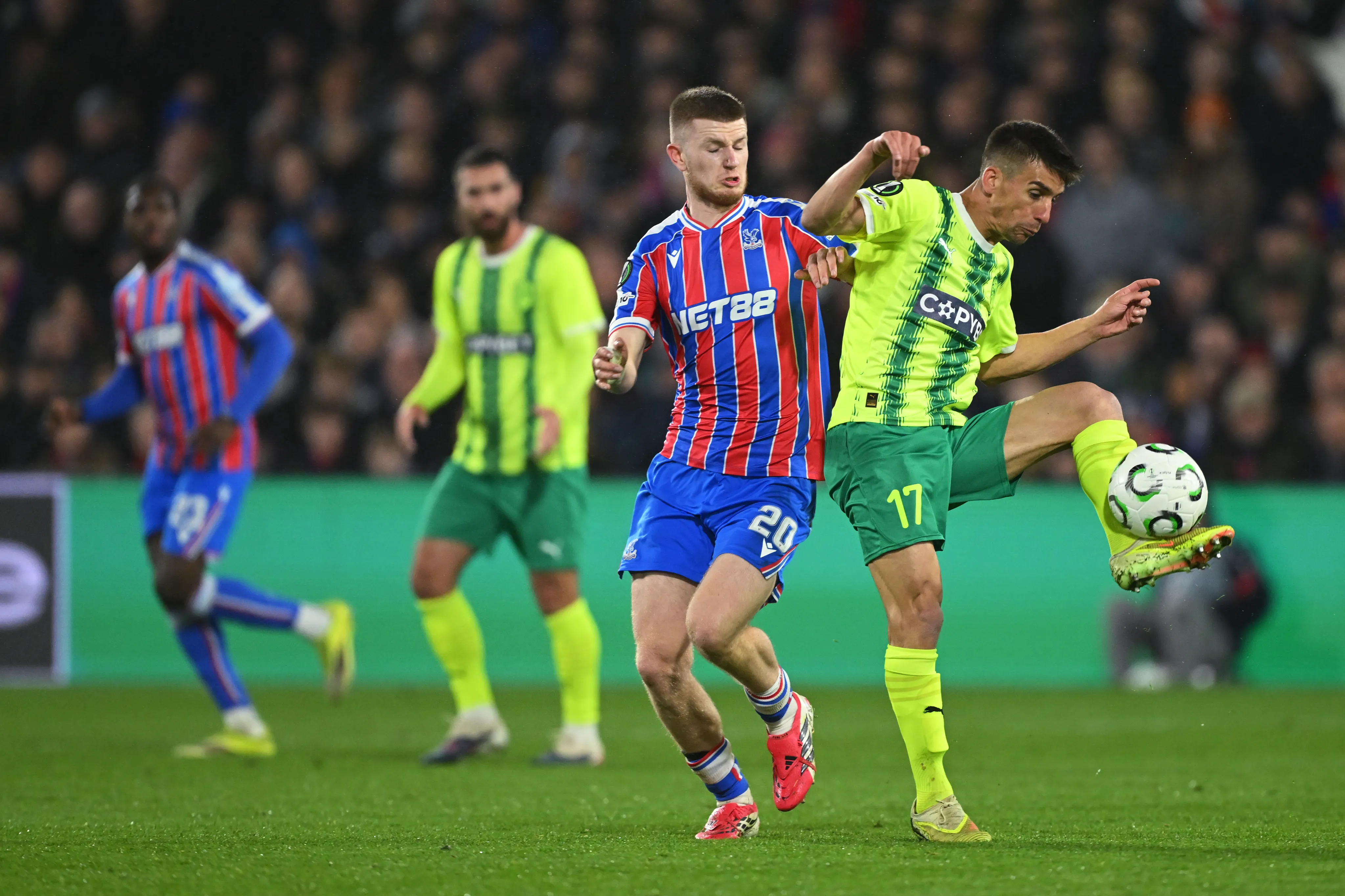 LONDON, ENGLAND – MARCH 12: Pere Pons of AEK Larnaca controls the ball under pressure from Adam Wharton of Crystal Palace during the UEFA Conference League 2025/26 round of 16 first leg match between Crystal Palace FC and AEK Larnaca FC at Selhurst Park on March 12, 2026 in London, England. (Photo by Mike Hewitt/Getty Images)
