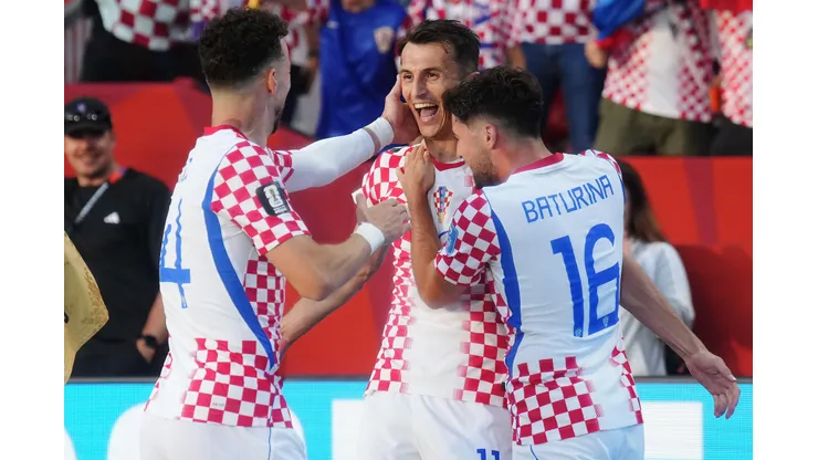 3ETT0DW Croatia's Ante Budimir (centre) celebrates his goal against Panama with Ivan Perisic (14) and Martin Baturina (16) during the second half of a World Cup Group L soccer match, in Toronto, on Tuesday, June 23, 2026. (Nathan Denette/The Canadian Press via AP)