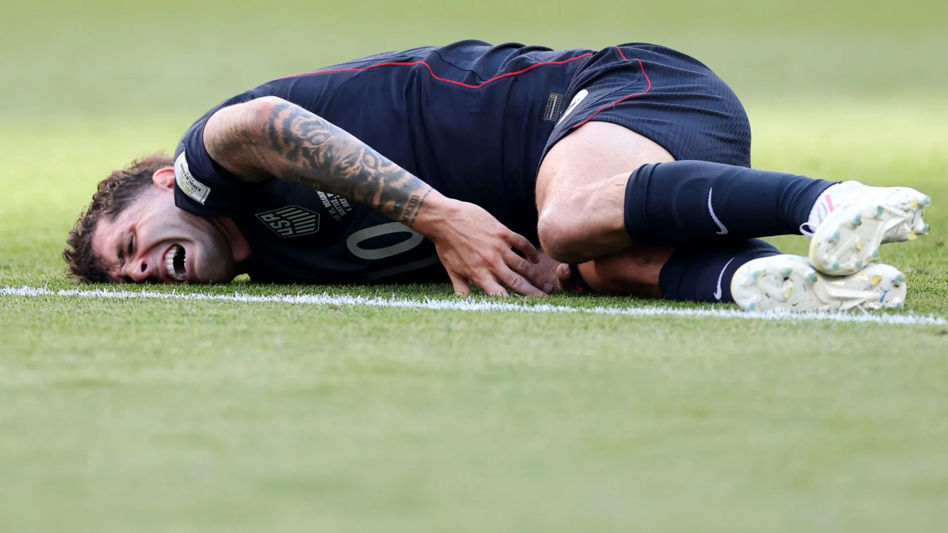 Pulisic fraturou a perna e foi substituído contra a Bélgica (foto: Carl Recine/Getty Images)