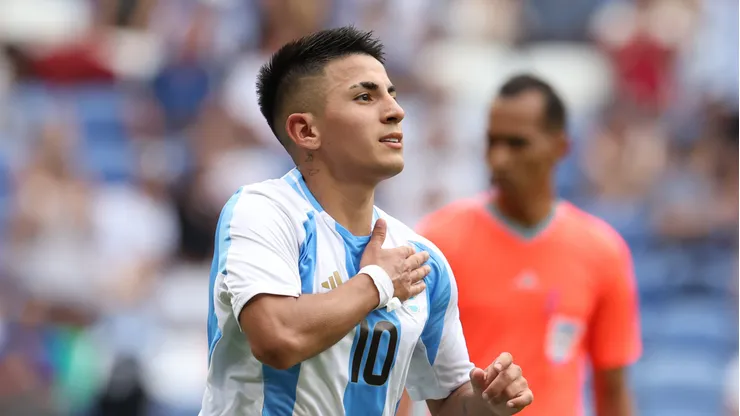 Thiago Almada #10 of Team Argentina celebrates with teammates scoring his team's first goal during the Men's group B match between Ukraine and Argentina during the Olympic Games Paris 2024 at Stade de Lyon on July 30, 2024 in Lyon, France.