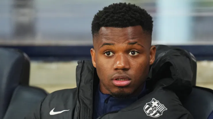 Ansu Fati of FC Barcelona looks on from the substitutes bench prior to the LaLiga match between FC Barcelona and Rayo Vallecano at Estadi Olimpic Lluis Companys on February 17, 2025 in Barcelona, Spain.