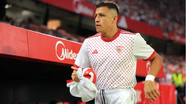 Alexis Sánchez of Sevilla FC looks on from the bench during the LaLiga EA Sports match between Sevilla FC and Elche CF at Estadio Ramon Sanchez Pizjuan on September 12, 2025 in Seville, Spain.