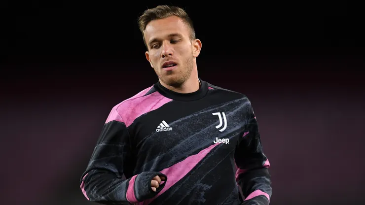 Arthur of Juventus F.C. warms up prior to the UEFA Champions League Group G stage match between FC Barcelona and Juventus at Camp Nou on December 08, 2020 in Barcelona, Spain. Sporting stadiums around Spain remain under strict restrictions due to the Coronavirus Pandemic as Government social distancing laws prohibit fans inside venues resulting in games being played behind closed doors.
