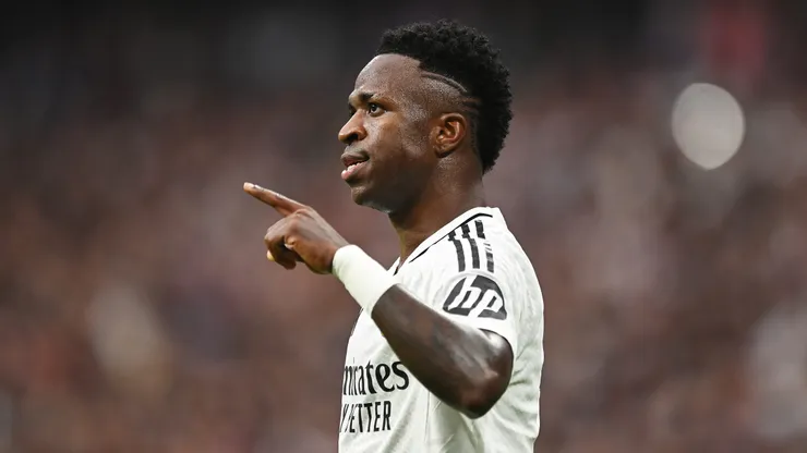 Vinicius Junior of Real Madrid celebrates scoring his team's third goal during the LaLiga match between Real Madrid CF and CA Osasuna at Estadio Santiago Bernabeu on November 09, 2024 in Madrid, Spain.