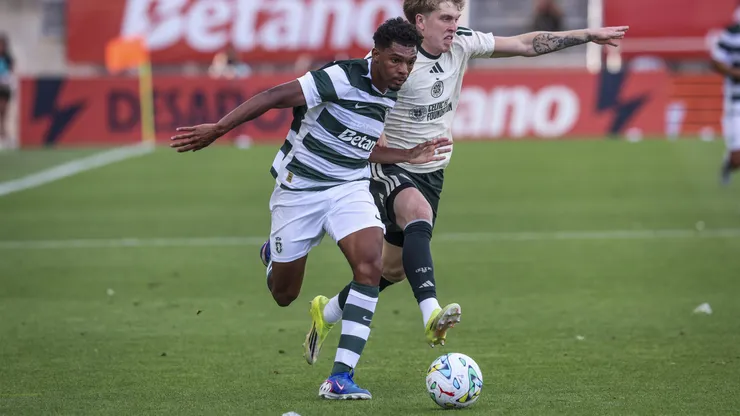 Luis Guilherme of Sporting CP (L) tries to escape Joseph Haney of Celtic FC (R) during the Sporting CP v Celtic FC Pre-Season Friendly match at Estadio Algarve on July 14, 2026 in Faro, Portugal.