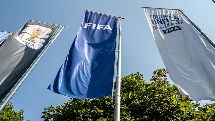 ZURICH, SWITZERLAND - JULY 30: FIFA flags flying outside FIFA (Fédération Internationale de Football Association) global headquarters on July 30, 2026 in Zurich, Switzerland. A recent proposal by FIFA President Gianni Infantino to sell off stakes in its football competitions has sparked backlash from some national and regional sports governing bodies. (Photo by Robert Hradil/Getty Images)
