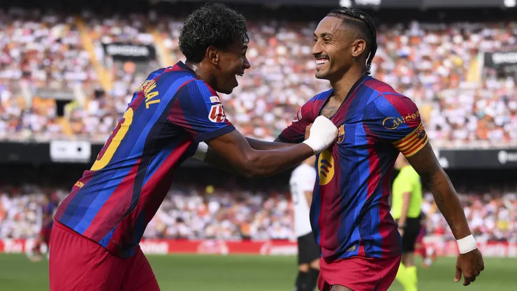 VALENCIA, SPAIN - SEPTEMBER 06: Raphinha of Barcelona celebrates scoring his team’s third goal with teammate Lamine Yamal during the LaLiga EA Sports 2026/27 match between Valencia CF and FC Barcelona at Estadi de Mestalla on September 06, 2026 in Valencia, Spain. (Photo by David Ramos/Getty Images)